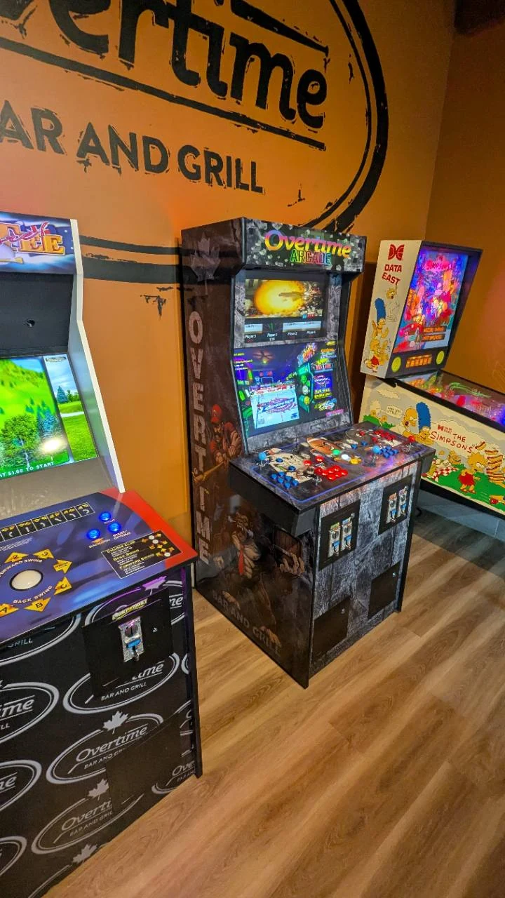Golden Tee, commercial arcade, and The Simpsons pinball at Overtime