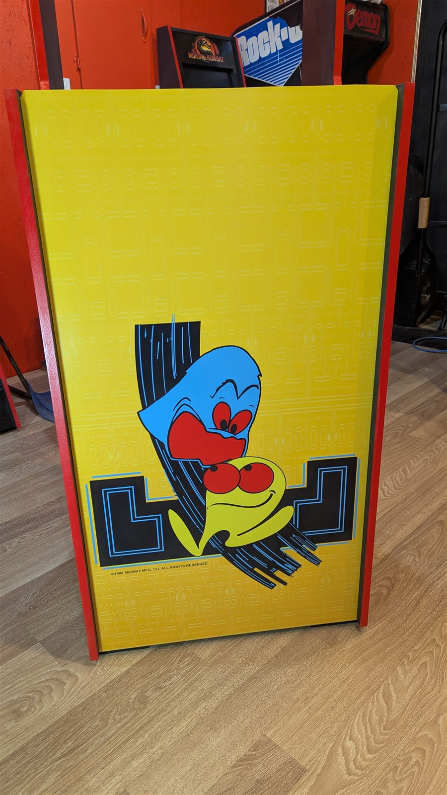 Installed yellow Pac-Man and ghost kickplate artwork on the Pac-Man Classic arcade machine